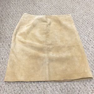 A tan mid length skirt